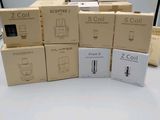 several boxes of cell phones stacked on top of each other on a table