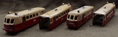 four toy trains sitting next to each other on a table