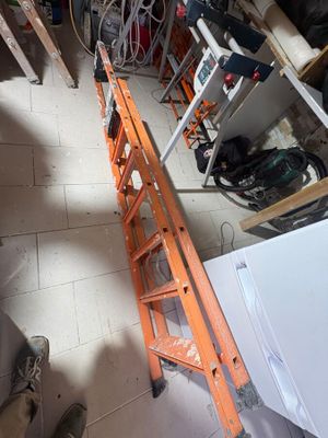 a ladder that is leaning against a wall in a garage
