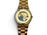 a gold wrist watch with a picture of a dog on it