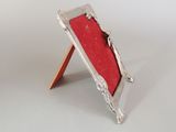 a picture of a picture frame with a red cloth on it