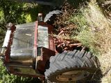 a tractor that is parked on the side of the road