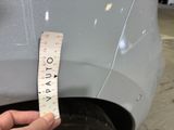 a measuring tape on the rim of a car