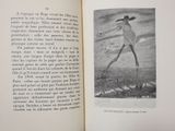 an open book with a picture of a man walking on a beach