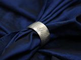 a ring that is on top of a blue cloth