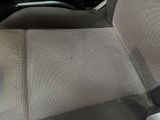 a dirty seat in the back of a car