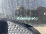 a close up of a car window with a sticker on it