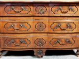 a wooden chest of drawers with a mirror on top of it
