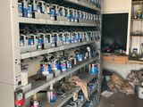 a room filled with lots of cans and cans of paint