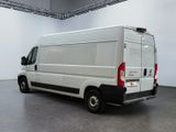 a white van that is parked in a large room
