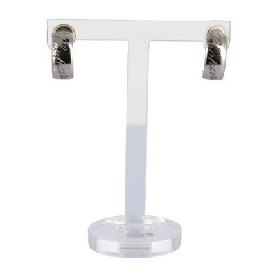 a close up of a pair of earrings on a stand