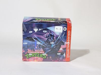 une boîte de Tortues Ninja sur une surface blanche