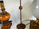two lamps and a lamp shade on a table