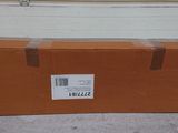 a brown box with a label on it sitting on the floor