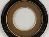 a picture of a black and gold picture frame on a wall