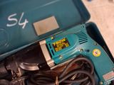 a blue box with a drill and other tools in it
