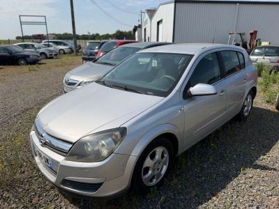 a silver car that is parked in a lot