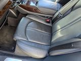 the interior of a car with leather seats and a steering wheel