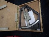 a box with a pair of scissors and a knife inside of it