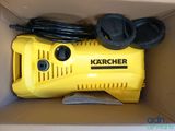 a box with a yellow karcher air compressor in it