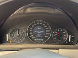 a close up of a car dashboard with a speedometer and gauges