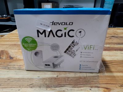 the box of the device is sitting on the wooden table