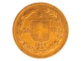 un gros plan d'une pièce d'or sur laquelle figure un blason
