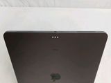an apple laptop computer sitting on top of a white surface