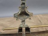 an image of a metal object sitting on top of a wooden floor