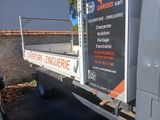 a truck that has a sign on the back of it