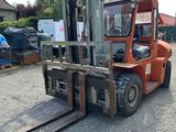 an image of a forklift parked in a parking lot