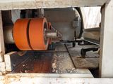 an image of a machine that is cutting a piece of wood