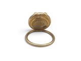an image of a gold ring with a small clock on it