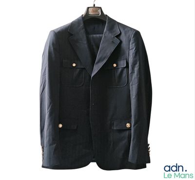 an image of a black jacket hanging on a hanger