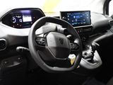 the interior of a car with a steering wheel, dashboard, and dash board
