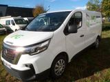 a picture of a white van parked in the grass