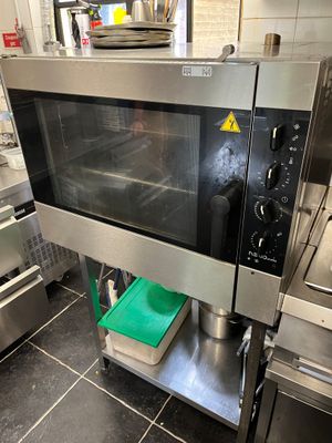 a microwave that is sitting in the middle of a kitchen