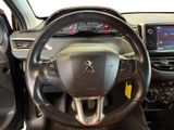 the interior of a car with a steering wheel and dashboard controls