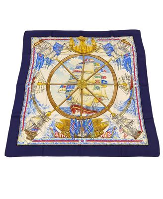a close up of a square scarf with a ship wheel on it