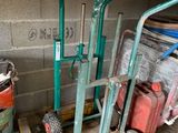 many different types of hand trucks in this garage