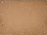 a close up of a piece of brown paper on a table