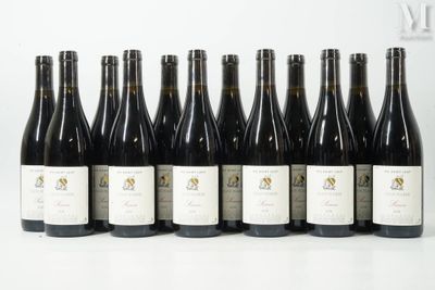 six bottles of wine are lined up in a row on a table