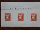 a stamp with three different stamps on it sitting on a table