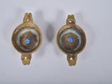 pair of antique brass wall sconces with blue glass eyes