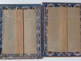 two books that are open on a table