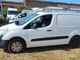 a white van that is parked in a lot