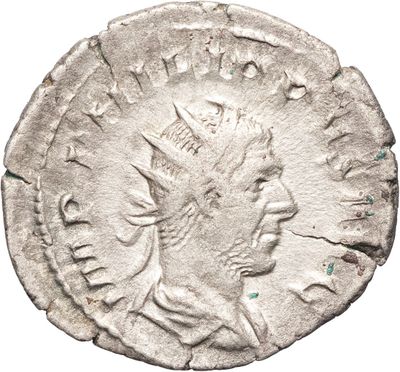 une pièce d'argent portant une tête d'homme