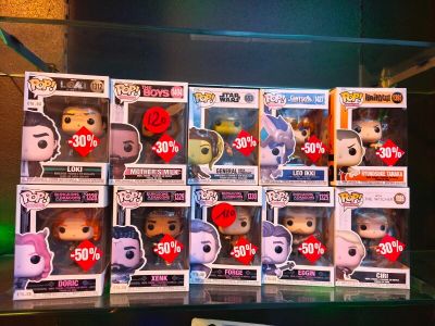 a lot of pop vinyl figures on display in the store