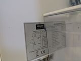 a close up of a white refrigerator with a label on it