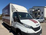 a delivery truck that is parked in a parking lot